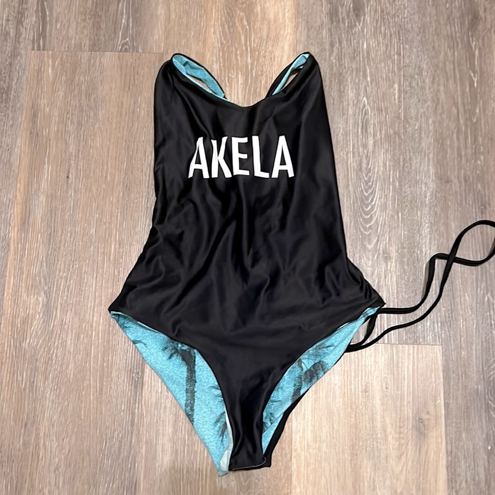 Akela one piece reversible cheeky with tie back